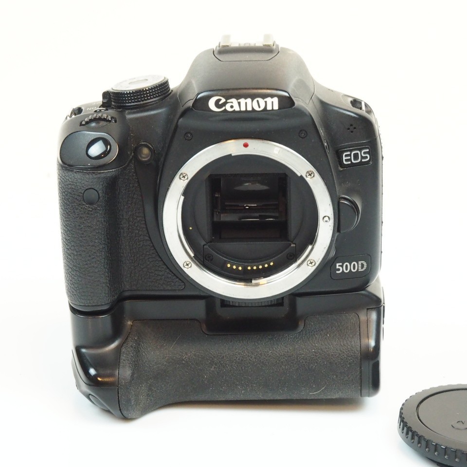 Canon EOS 500D 15.1MP Digital SLR *Camera Body Only* + grip and strap 2 Canon EOS 500D 15.1MP Digital SLR *Camera Body Only* + grip and strap